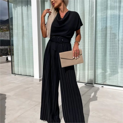 Effen gekleurde jumpsuit met hoge taille en geplooide pijpen