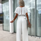 Effen gekleurde jumpsuit met hoge taille en geplooide pijpen