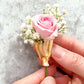 Draagbare bloemenbrochespeld